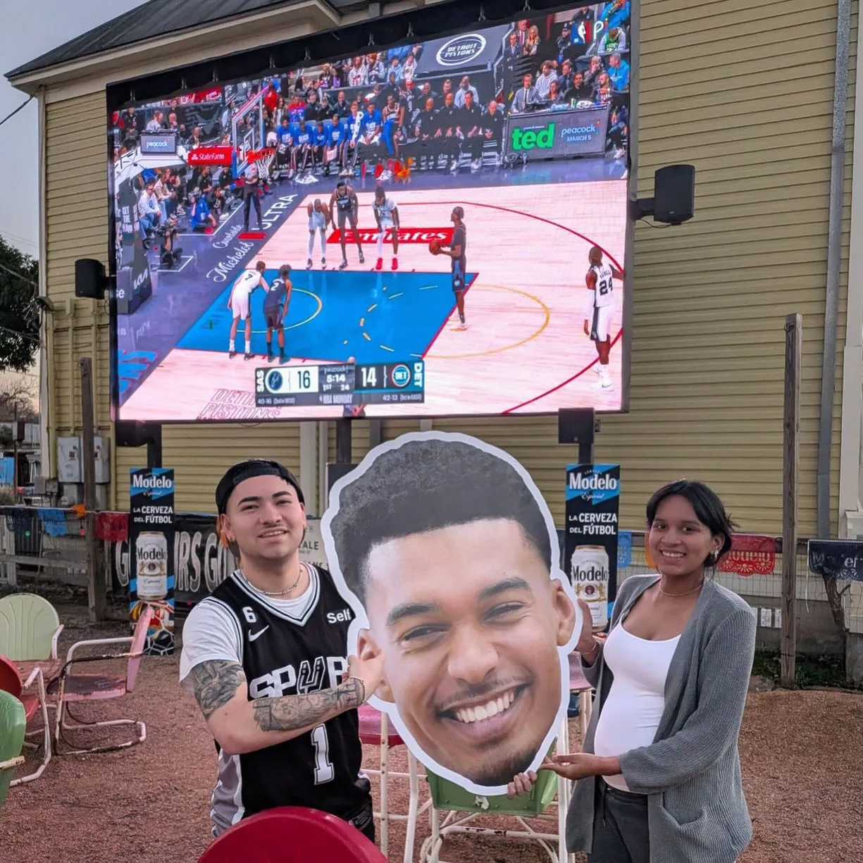 The FriendlyTron LED screen with fans watching Spurs